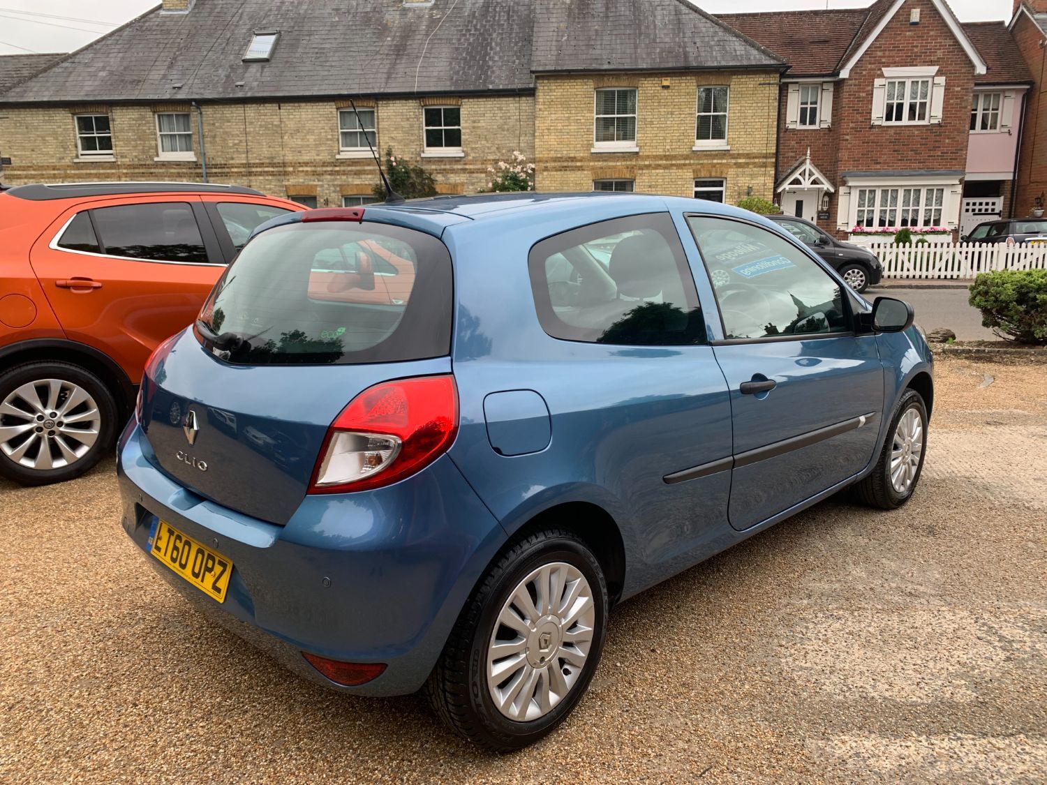 Renault clio with oversized alloy wheels on Craiyon